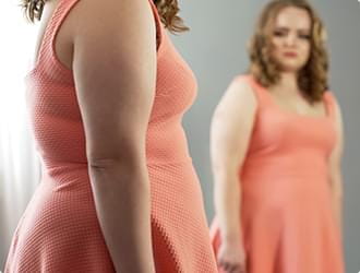 Woman looking at mirror
